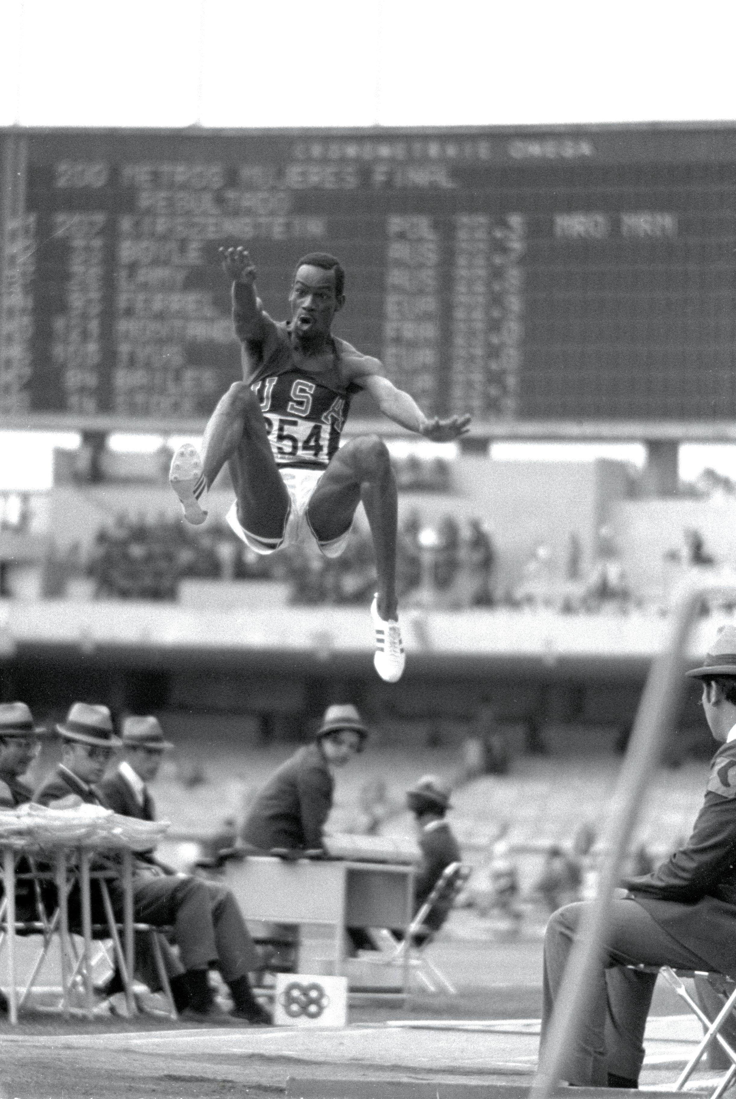  18 Oct 1968:. Bob Beamon # 254 of the US  breaking the Long Jump World Record during the  1968 Olympic Games in Mexico City, Mexico Beamon  long jumped 8.9 m (29 ft 2 1/2 in), winning the  gold medal and setting a new . It is the first  world record jump over 28 ft The most famous long  jump ever Achieved:. Bob Beamon of the United  States takes off for a place in sporting history  as he leaps 8.90 meters at the Mexico City Games  of 1968. While the middle distance runners from  the low level countries floundered in the thin air  of Mexico City, Those in the explosive events  reached new peaks, none higher than Beamon, who  added 58 centimètres to the world record with a  jump aided by a wind of 2 meters per second the  very limit of wind assistance. In Imperial measure  terms it Looked even more impressive since he  missed out 28 feet, taking the record to 29 ft 2  ins. Yet Beamon never again managed a jump of 27  feet. It was twelve years before anyone else  reached 28 feet (8:53 meters) and the record stood  until 1991 When Mike Powell of the US leapt 8.95  meters in Tokyo to win the world title. His jump  which at sea level and wind assistance of 0.3mps.  Mandatory Credit: Tony Duffy / Allsport 