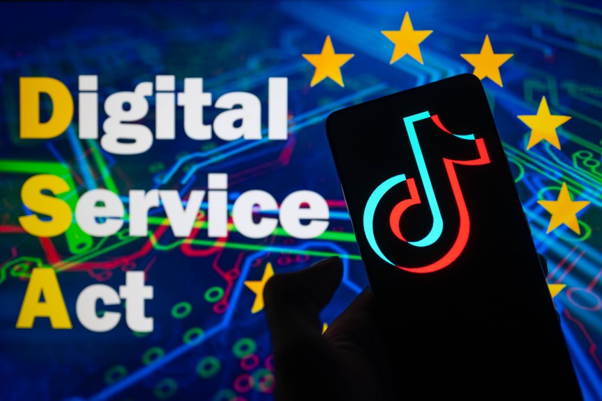 EU – Social Media – Disinformation- Photo Illustration TikTok logo displayed on a smartphone with European Commission Di