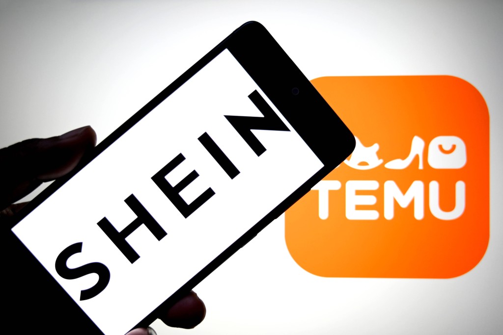 Photo illustration in India - 07 Aug 2025 In this photo illustration, a SHEIN logo is seen displayed on a smartphone with a TEMU logo in the background. India Copyright: xAvishekxDasx/xSOPAxImagesx avdtnmyaug25lot2u