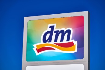 Mindelheim, Bavaria, Germany – August 31, 2025: Logo of the retail chain dm Drogeriemarkt on a large sign in front of a