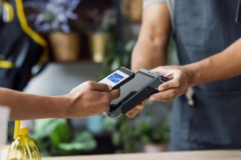 Entrepreneur accepting mobile payment with credit card terminal model released, Symbolfoto property released, JSRF04158