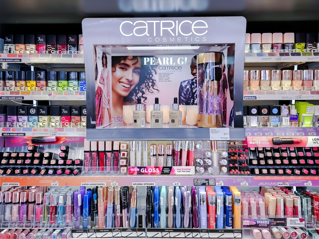 LATVIA, RIGA, APRIL, 2023: Catrice stand with decorative cosmetics for make-up in a shopping center.